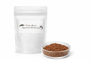 Color-Burst Aquarium Shrimp Food in white resealable pouch and glass dish with brown pellets